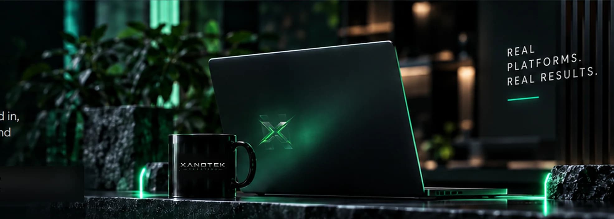 A Xanotek Creation laptop and mug in a dark studio